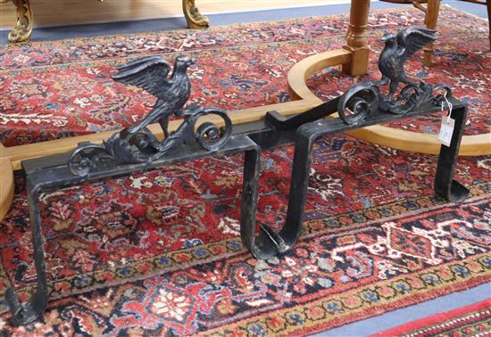 A pair of cast and wrought iron andirons W.59cm approx